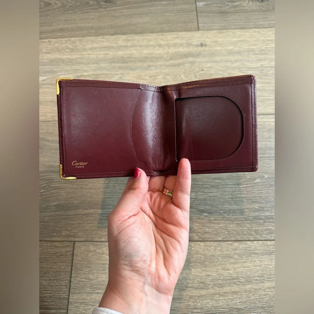 Cartier Men’s Deep Red Leather Bifold with Gold Corners